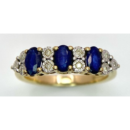 1311 - A Three Stone Sapphire and Diamond 9K Yellow Gold Ring. Size L. 2.53g total weight.