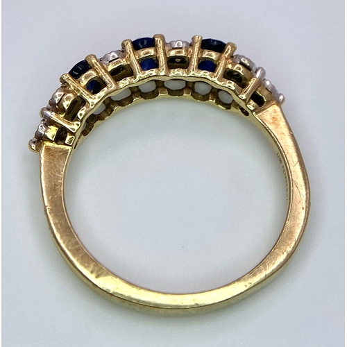 1311 - A Three Stone Sapphire and Diamond 9K Yellow Gold Ring. Size L. 2.53g total weight.