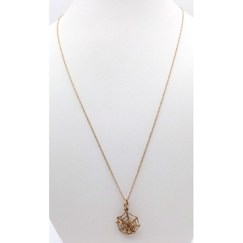 1337 - A fancy 9K yellow gold spider wed pendant on gold chain. Total weight 1.8G. Total length 46cm.