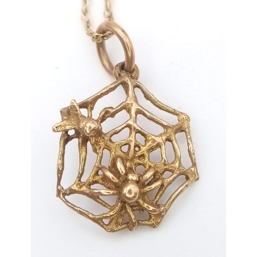 1337 - A fancy 9K yellow gold spider wed pendant on gold chain. Total weight 1.8G. Total length 46cm.