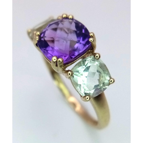 1340 - An Amethyst and Aquamarine 9K Yellow Gold Ring. Size P. 2.75g total weight.