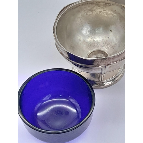 1488 - A SILVER FOOTED SALT HALLMARKED BIRMINGHAM 1913 WITH BLUE GLASS LINER BUT MISSING THE SPOON .  SILVE... 