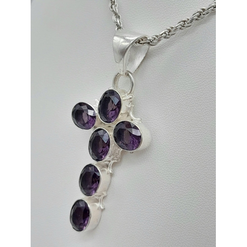 1525 - An Amethyst Cross Silver Pendant on a 925 Silver Chain. 50cm and 6cm.