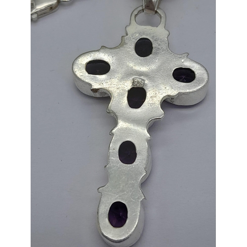 1525 - An Amethyst Cross Silver Pendant on a 925 Silver Chain. 50cm and 6cm.