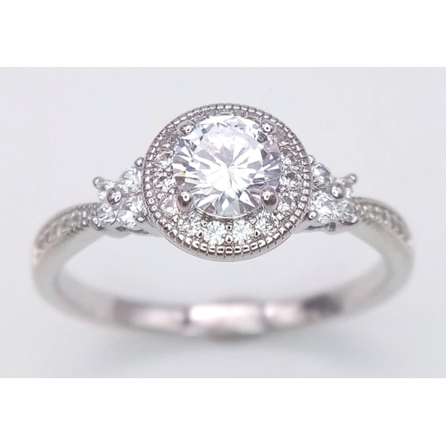 1640 - A 925 Silver Bright Zircon Ring. Size U.