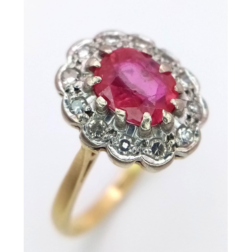 1650 - An 18K Yellow Gold, Burmese Ruby and Diamond Ring. 1ct central oval cut ruby with a diamond surround... 