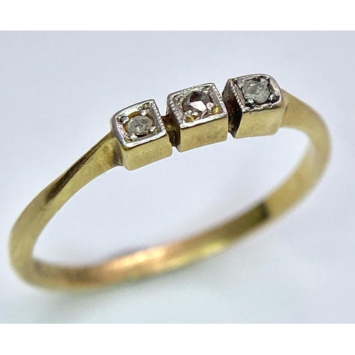 1691 - An Art Deco 18K Gold and Platinum Three Stone Old Cut Diamond Ring. Size M. 1.6g total weight.