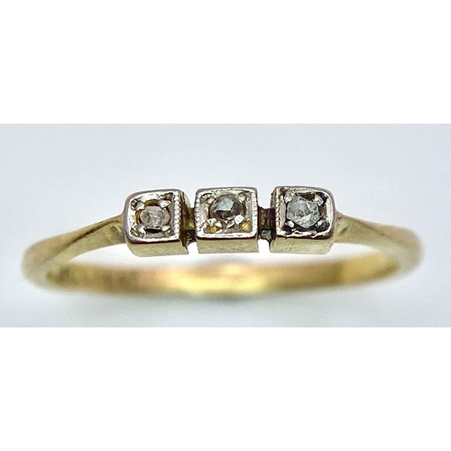 1691 - An Art Deco 18K Gold and Platinum Three Stone Old Cut Diamond Ring. Size M. 1.6g total weight.