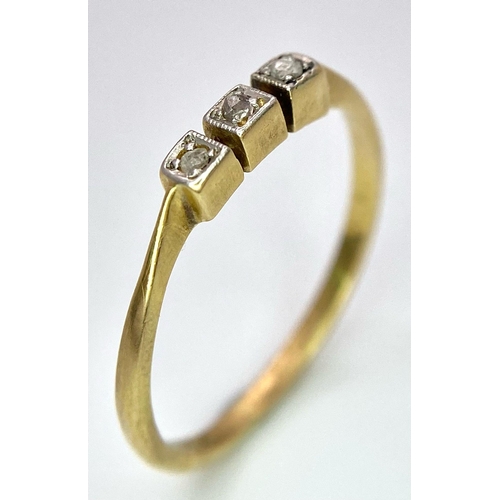 1691 - An Art Deco 18K Gold and Platinum Three Stone Old Cut Diamond Ring. Size M. 1.6g total weight.