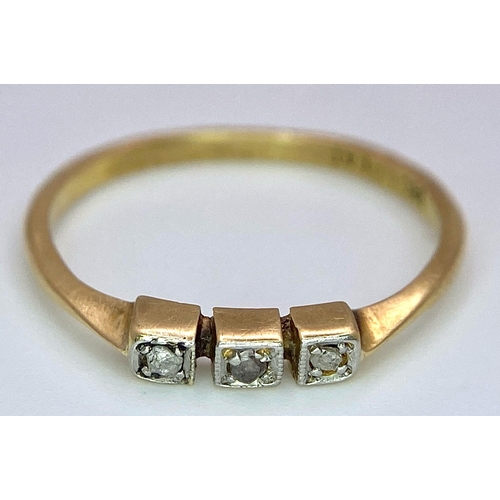 1691 - An Art Deco 18K Gold and Platinum Three Stone Old Cut Diamond Ring. Size M. 1.6g total weight.