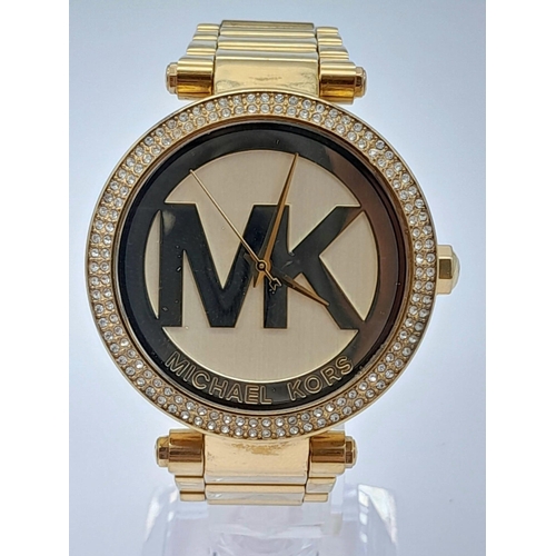 1771 - A Michael Kors Gold Plated Ladies Dress Watch. Gold plated bracelet and case - 38mm. MK gilded dial.... 