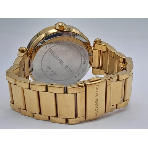 1771 - A Michael Kors Gold Plated Ladies Dress Watch. Gold plated bracelet and case - 38mm. MK gilded dial.... 