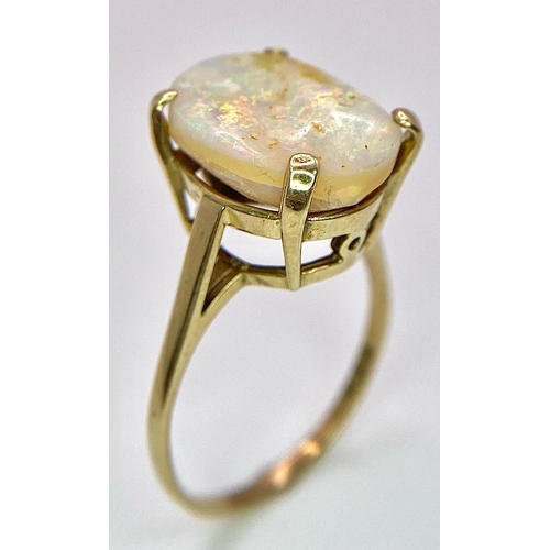 1629 - A 9K Yellow Gold and Australian Opal Ring. Excellent colour play with approx 4ct opal. Size P. 3g to... 