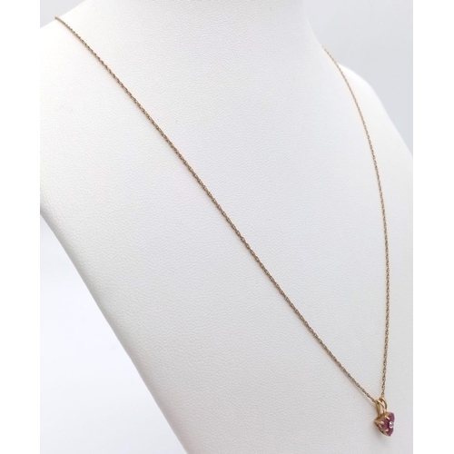 1382 - A fancy 9K yellow gold Ruby and Diamond pendant on gold chain. Total weight 1.4G. Total length 50cm.