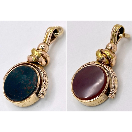 1671 - A 2 COLOUR AGATE WATCH FOB .   7.5gms