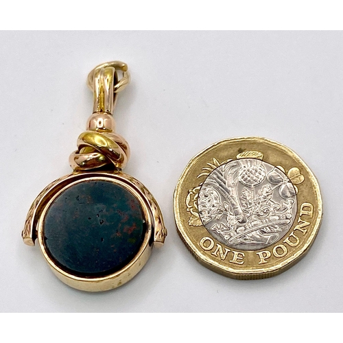 1671 - A 2 COLOUR AGATE WATCH FOB .   7.5gms