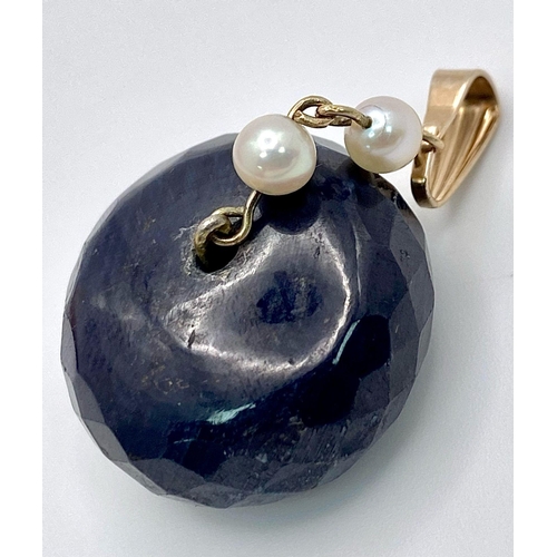 1678 - A LARGE NATURAL SAPPHIRE AND SEED PEARLS PENDANT IN YELLOW METAL .    9.9gms