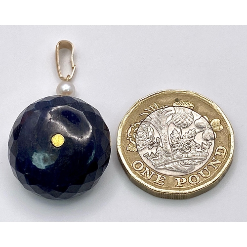 1678 - A LARGE NATURAL SAPPHIRE AND SEED PEARLS PENDANT IN YELLOW METAL .    9.9gms