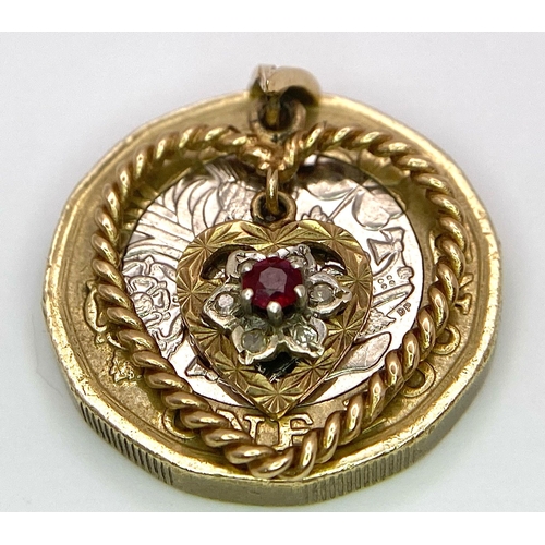 1684 - A 9K Yellow Gold (tested) Diamond and Ruby Heart Pendant. 
3cm. 1.8g total weight.