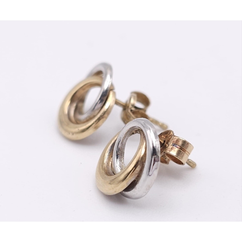 1785 - A Pair of Yellow and White 9K Gold Small Double Spiral Earrings. 0.8g weight.