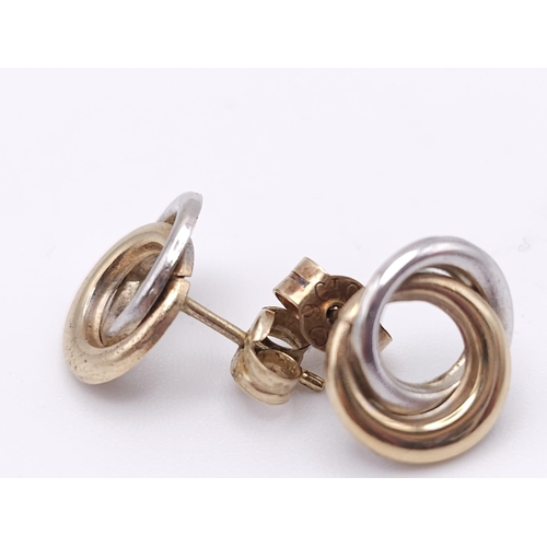 1785 - A Pair of Yellow and White 9K Gold Small Double Spiral Earrings. 0.8g weight.