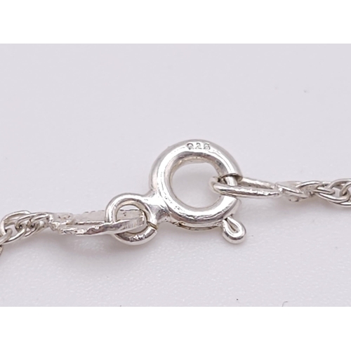 1221 - A 925 Silver Chain with Cross Pendant. 58cm and 2cm.