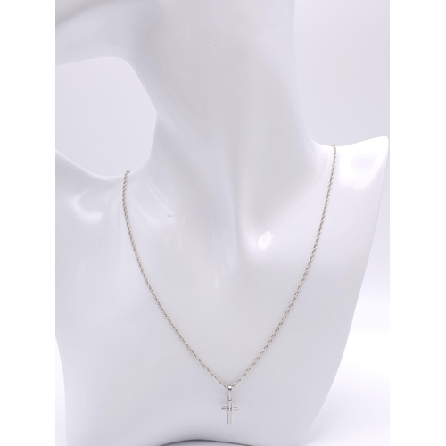 1221 - A 925 Silver Chain with Cross Pendant. 58cm and 2cm.