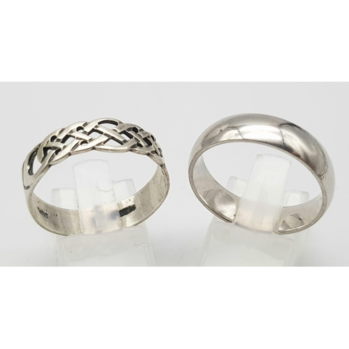 1310 - 2 X STERLING SILVER BAND RINGS, ONE PLAIN RING SIZE V & ONE CELTIC DESIGN RING SIZE W 8.6G