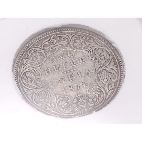 1353 - A Sangs 1876 Silver Indian One Rupee Coin. Comes in a sealed container.