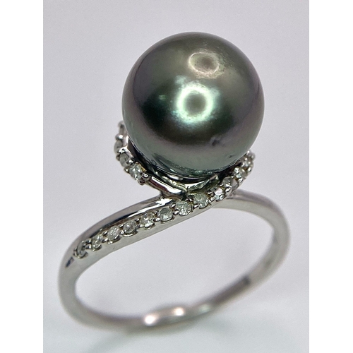 1692 - A TAHITIAN PEARL AND DIAMOND RING SET IN 9K WHITE GOLD .   5.2gms   size S