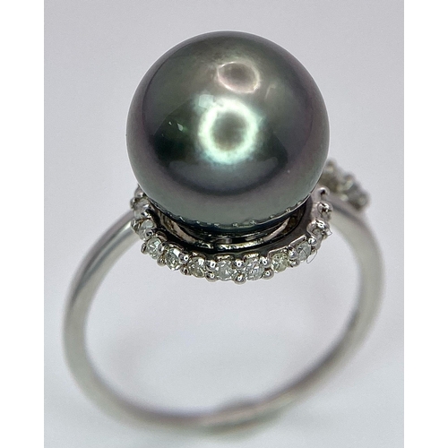 1692 - A TAHITIAN PEARL AND DIAMOND RING SET IN 9K WHITE GOLD .   5.2gms   size S