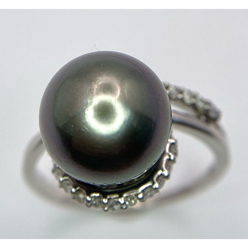 1692 - A TAHITIAN PEARL AND DIAMOND RING SET IN 9K WHITE GOLD .   5.2gms   size S