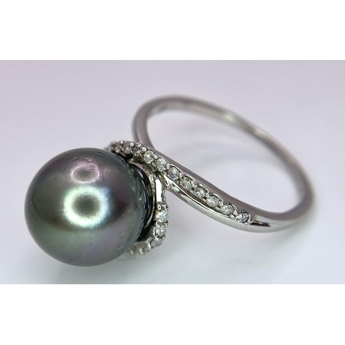 1692 - A TAHITIAN PEARL AND DIAMOND RING SET IN 9K WHITE GOLD .   5.2gms   size S