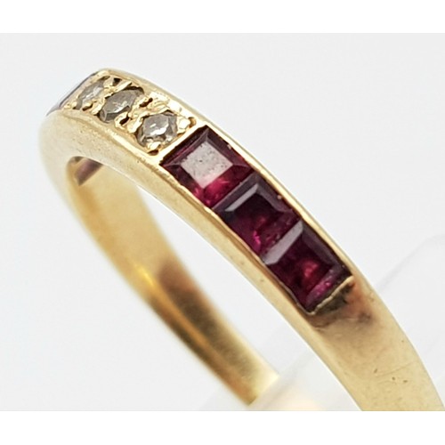 1385 - A 9K YELLOW GOLD DIAMOND & RED STONE RING. TOTAL WEIGHT 1.5G. SIZE L