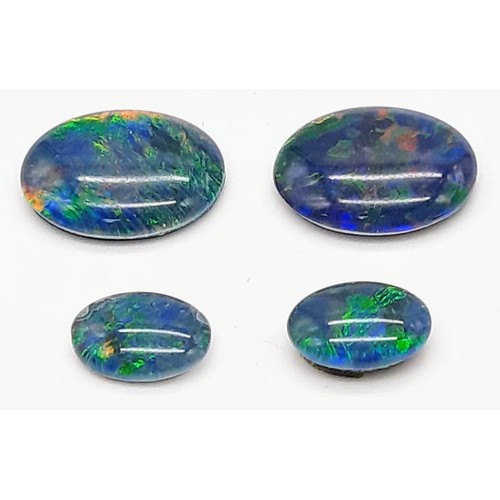 1213 - Four Black Opal Doublets. 7.46 Carats Total.