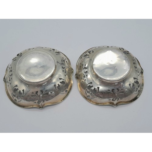 1474 - A PAIR OF PIERCED SILVER DISHES DATED 1946 .   7.5cms DIAMETER     36.2gms