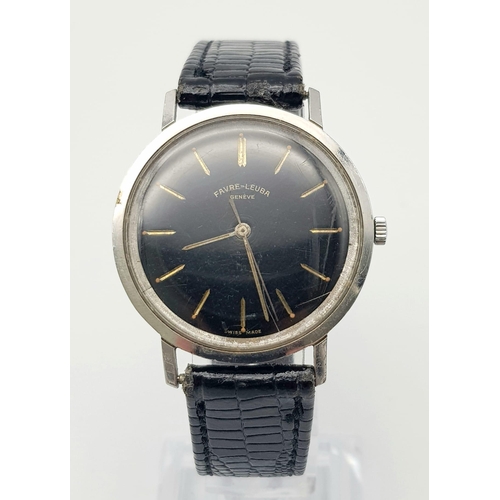 214 - A Vintage Favre-Leuba Mechanical Gents Watch. Black leather strap. Thin stainless steel case - 33mm.... 