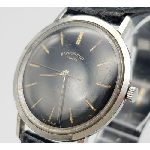 214 - A Vintage Favre-Leuba Mechanical Gents Watch. Black leather strap. Thin stainless steel case - 33mm.... 