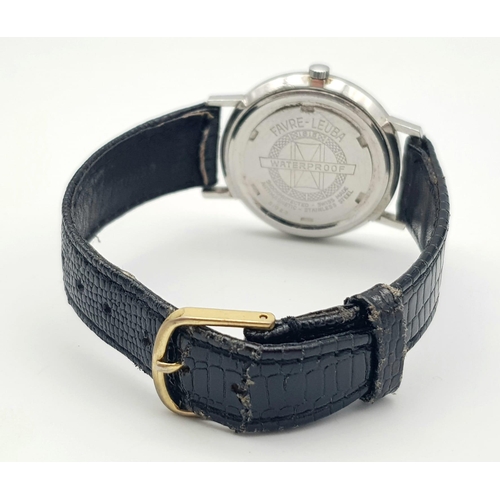 214 - A Vintage Favre-Leuba Mechanical Gents Watch. Black leather strap. Thin stainless steel case - 33mm.... 