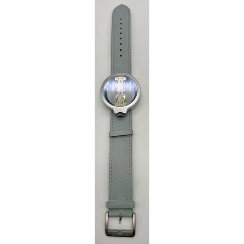 310 - A Verticale Mechanical Top Winder Gents Watch. Pale blue leather strap. Silver tone ceramic gilded s... 