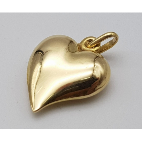 323 - An 18K Yellow Gold Heart Pendant/Charm. 2.5cm. 2.75g weight.