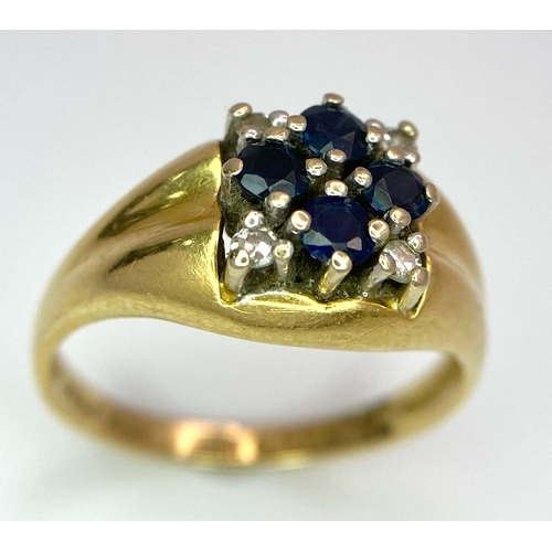 4 - An 18K Yellow Gold Sapphire and Diamond Ring. A cross of four central sapphires with a diamond in ea... 