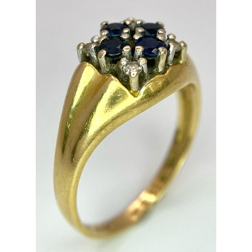 4 - An 18K Yellow Gold Sapphire and Diamond Ring. A cross of four central sapphires with a diamond in ea... 