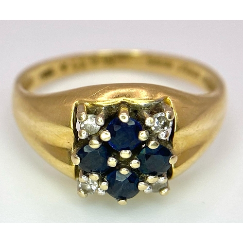 4 - An 18K Yellow Gold Sapphire and Diamond Ring. A cross of four central sapphires with a diamond in ea... 