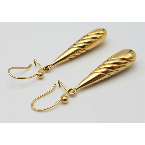 702 - A Pair of 9k Yellow Gold Elongated Teardrop Earrings. 3cm drop. 2.33g weight.