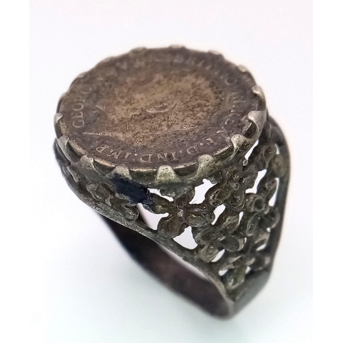 1314 - A vintage sterling silver Georgian coin ring with floral design on shoulder. Total weight 4.8G. Size... 