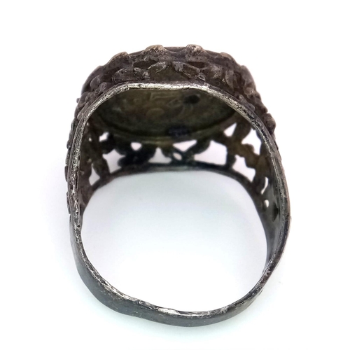 1314 - A vintage sterling silver Georgian coin ring with floral design on shoulder. Total weight 4.8G. Size... 