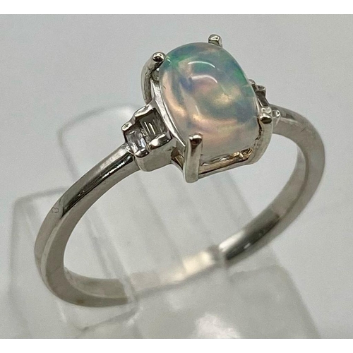 1319 - Opal and diamond silver set ring, weight 1.6g size K