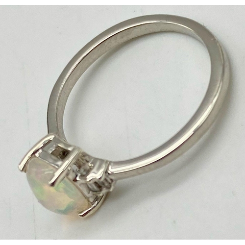 1319 - Opal and diamond silver set ring, weight 1.6g size K