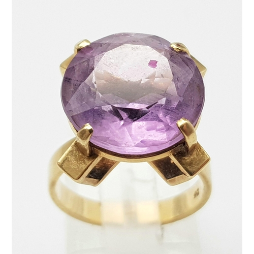 241 - A Vintage 9K Yellow Gold Amethyst Ring. 10ct round cut amethyst set in a raised foundation. Size K. ... 